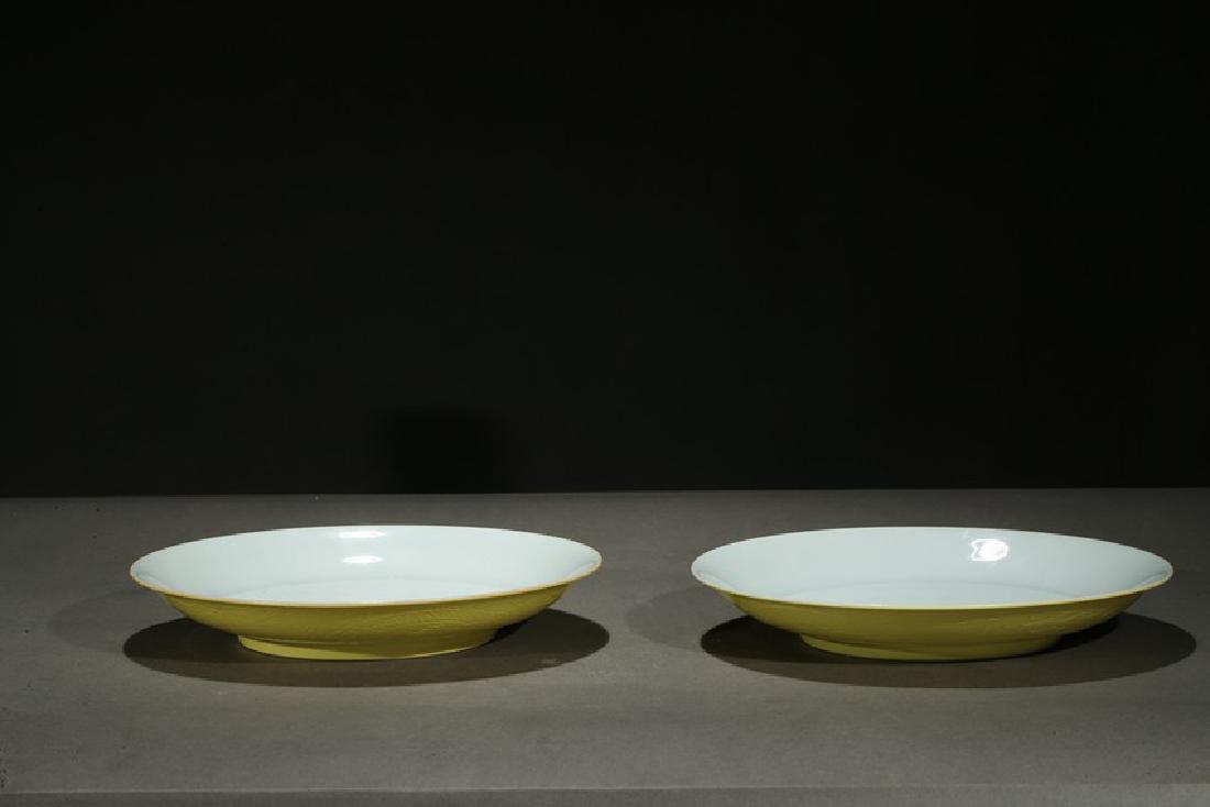 A PAIR OF YELLOW GLAZED INCISED DISHES (1 of 6)