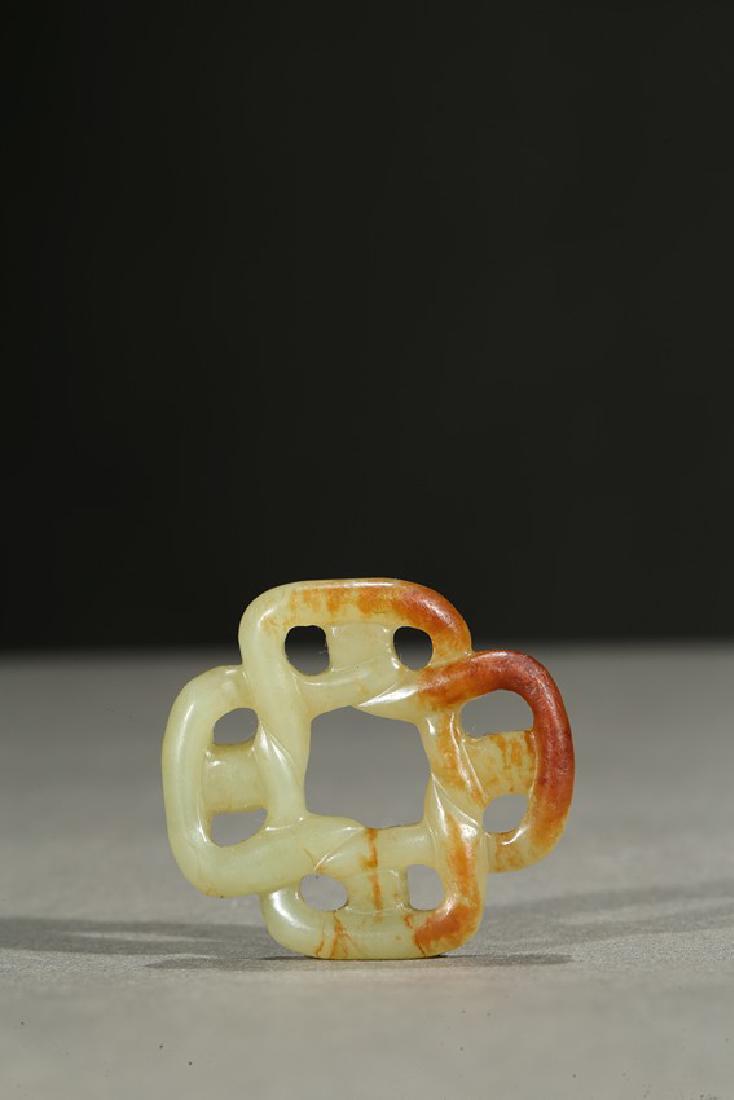 A WHITE JADE OPENWORK ORNAMENT (1 of 5)