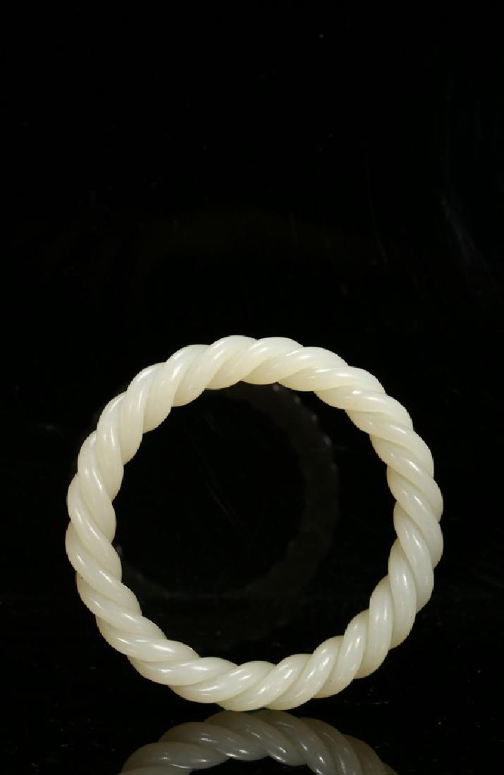 A WHITE JADE TWIST-ROPE BANGLE (1 of 5)