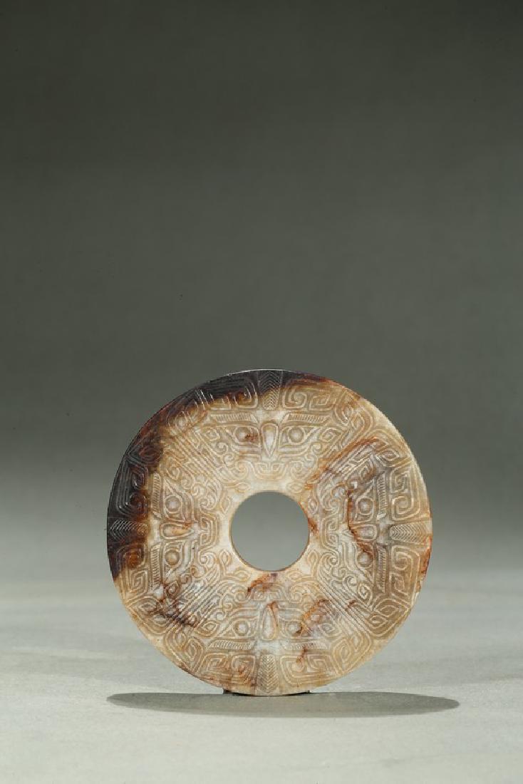 AN ARCHAIC RUSSET JADE TAOTIE DISC BI (1 of 8)