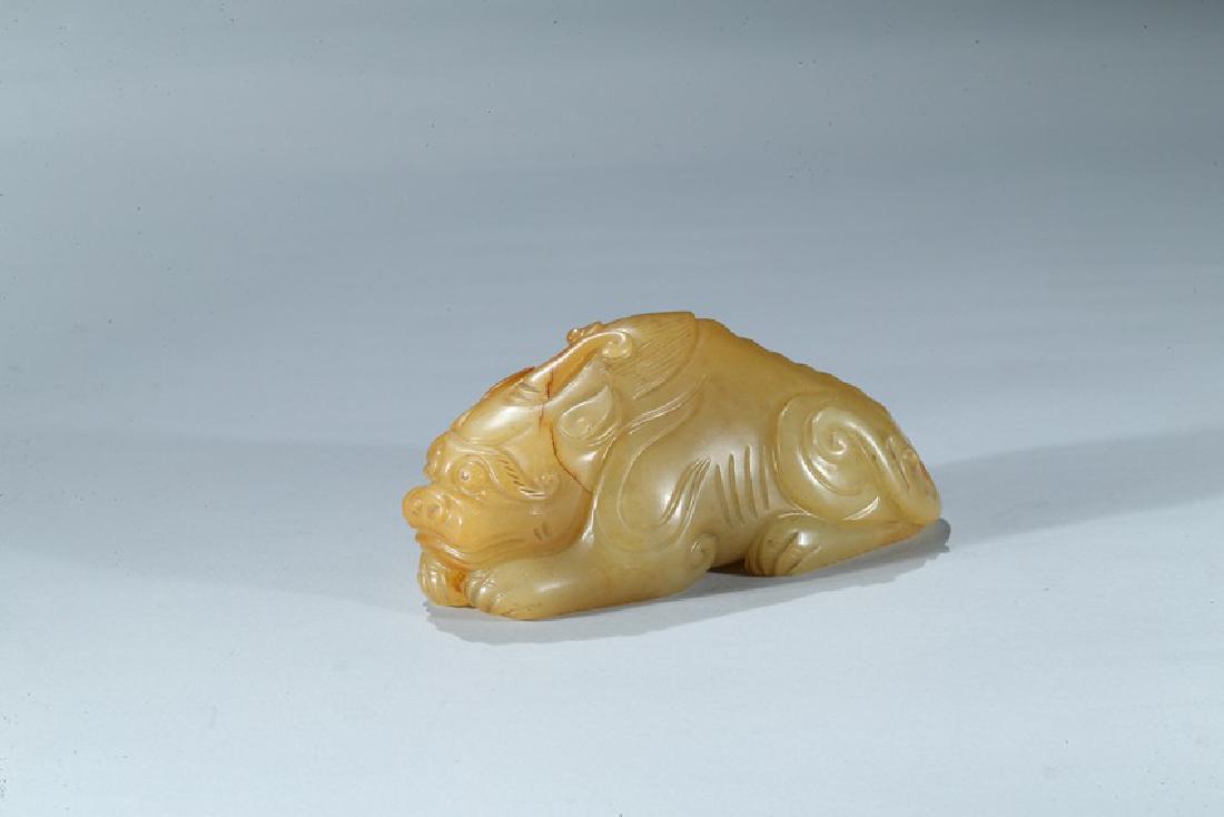A CHINESE YELLOW JADE CARVING OF MYTHICAL BEAST (1 of 9)