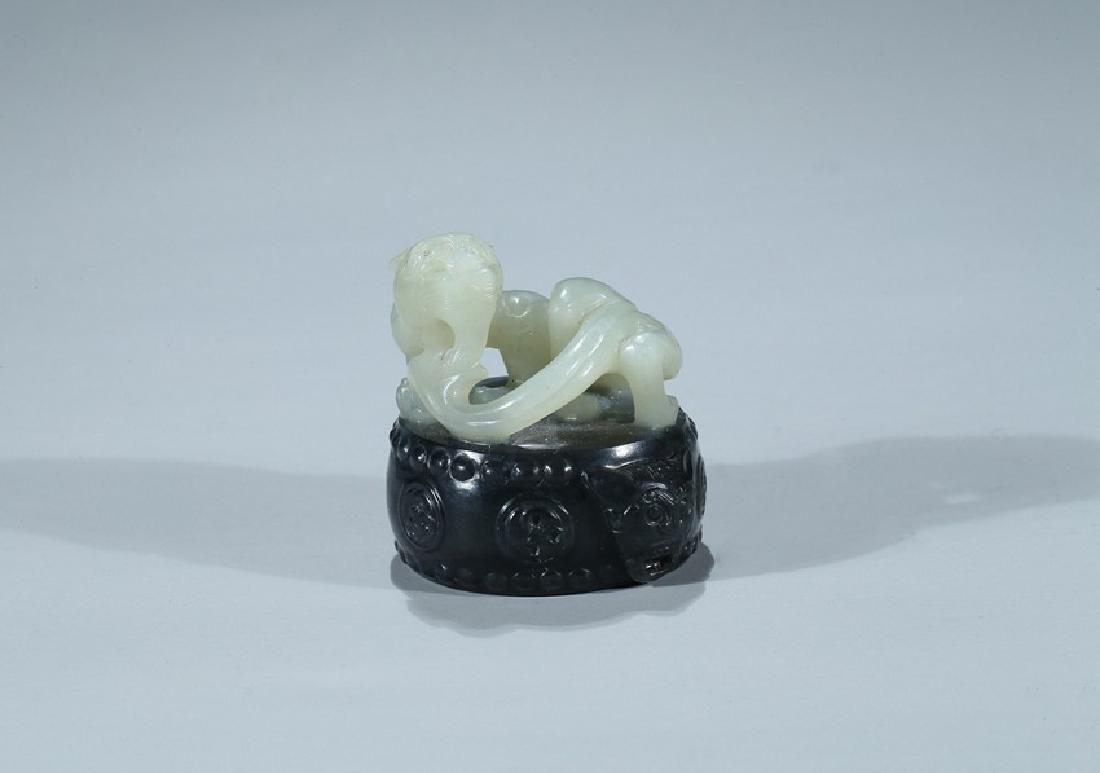 A CHINESE BLACK AND WHITE JADE 'CHILONG AND DRUM' SEAL (1 of 11)