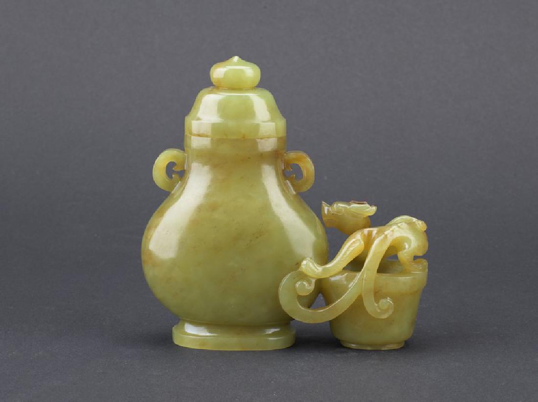 A YELLOW JADE CARVED 'CHILONG' JOINED VESSEL (1 of 7)