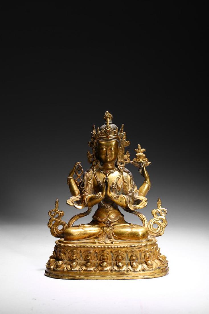 A GILT BRONZE FIGURE OF FOUR-ARMED BODHISATTVA: The bodhisattva seated on a double-lotus throne, the primary hands in anjali mudra, the secondary left hand holding ritual object and the secondary right hand holding bead bracelet, wearing the bodhis