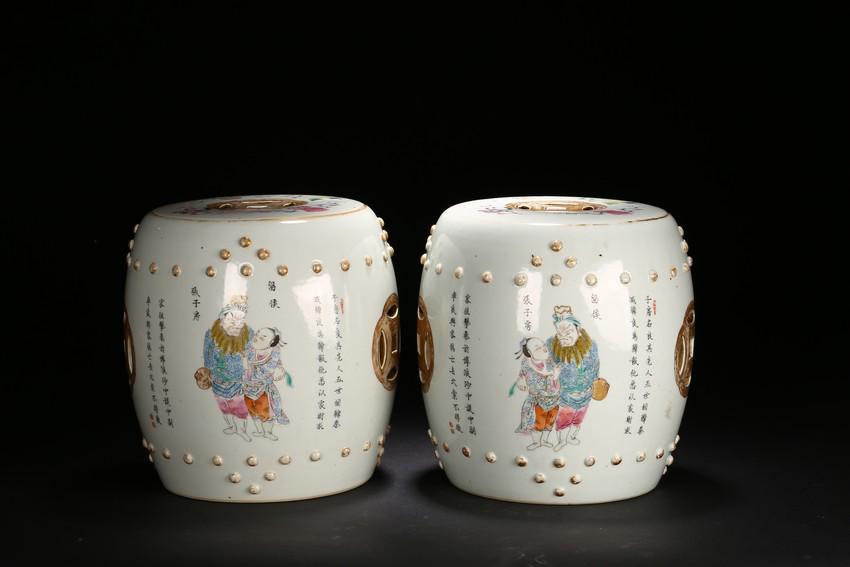 A PAIR OF FAMILLE ROSE 'FIGURESâ€˜ DRUM STOOLS: Each of drum shape, painted with historical figures from Han Dynasty period with inscriptions interspaced by openwork coin motif and flanked by two band of raised bosses, the top carved with similar c