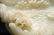 A CHINESE WHITE JADE BOULDER WITH STAND - 11