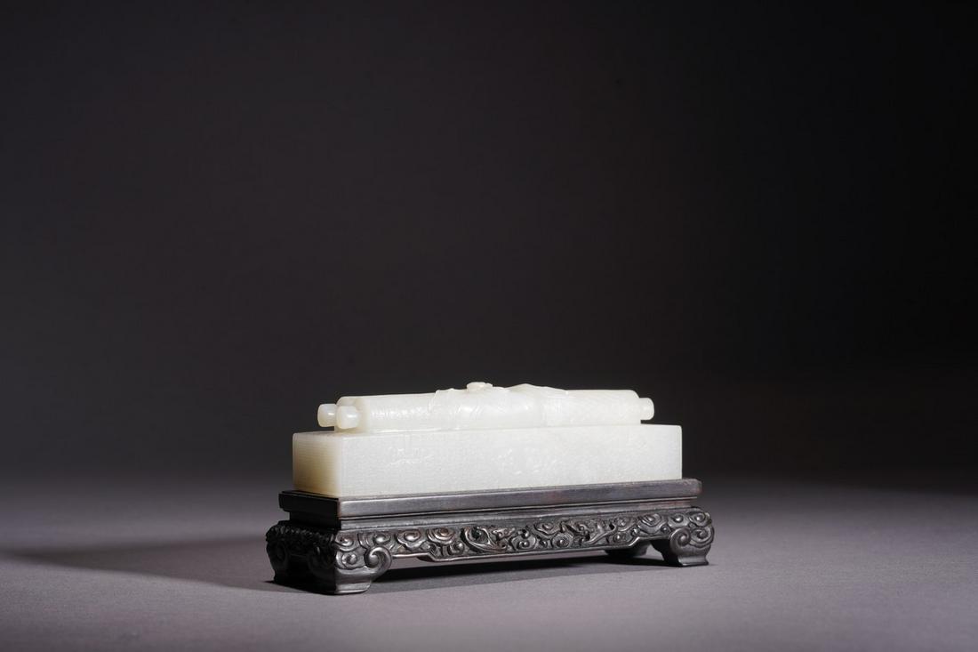 A CHINESE WHITE JADE 'HANDSCROLL' PAPERWEIGHT (1 of 4)
