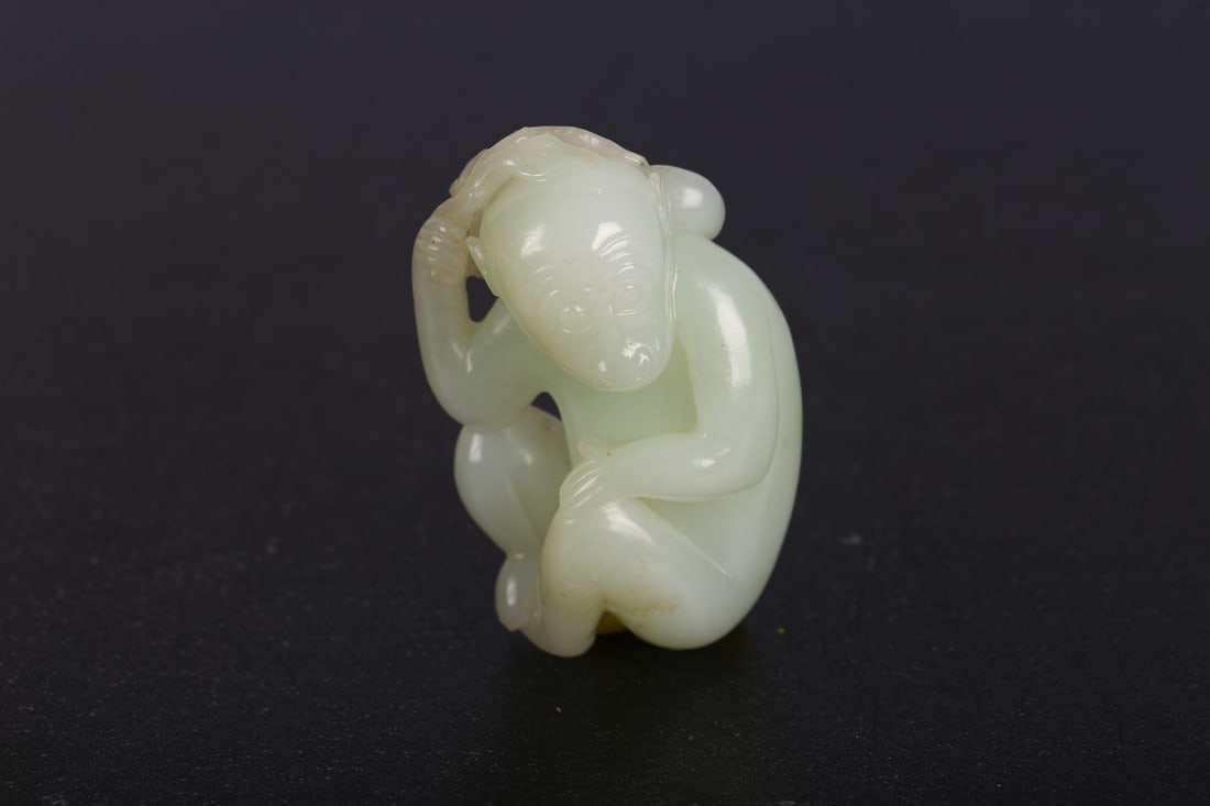 A CHINESE WHITE JADE CARVING OF MONKEY (1 of 5)