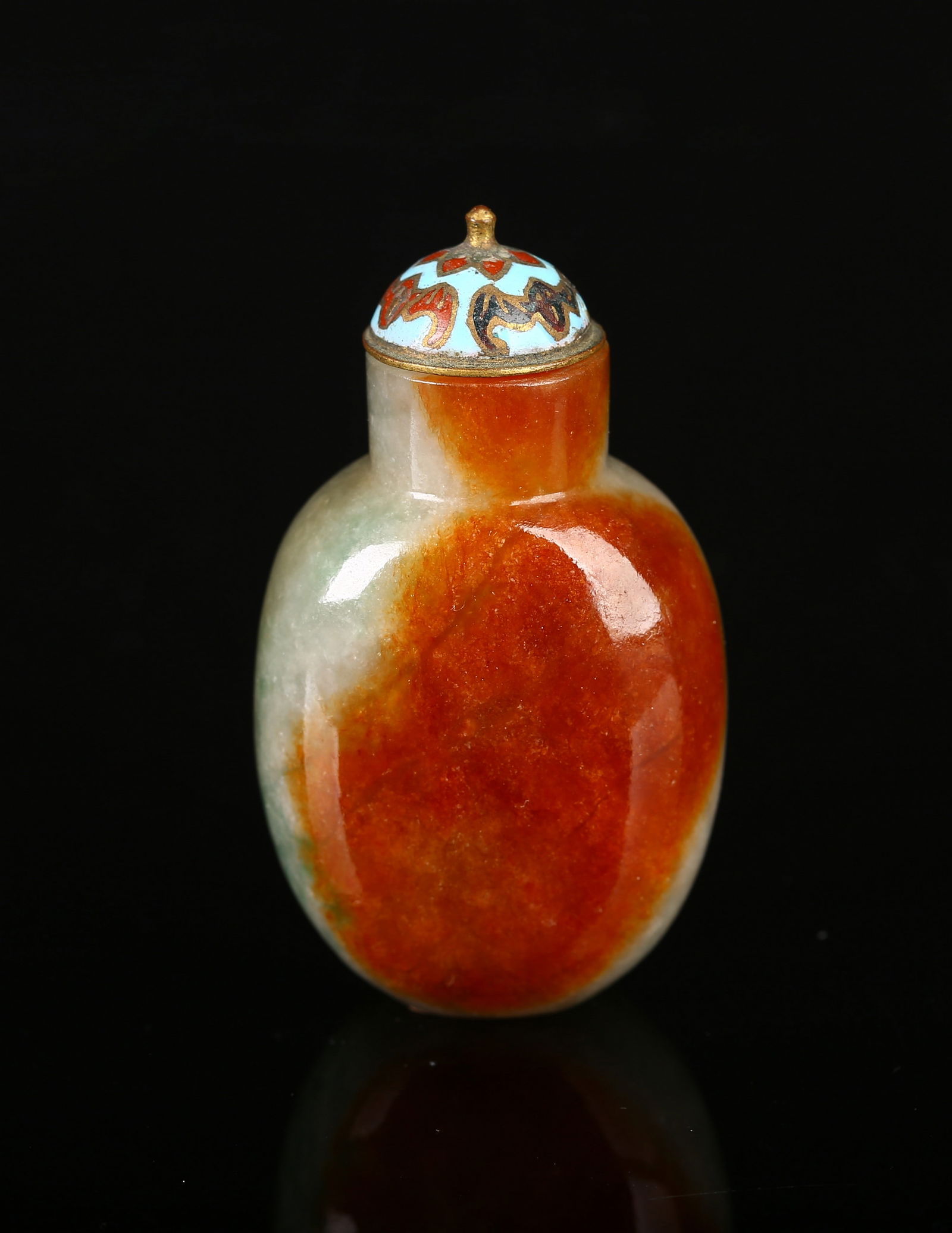 A Red Jadeite Snuff Bottle: 清 紅翡光素鼻煙壺 A Red Jadeite Snuff Bottle Well hollowed, of ovoid shape with cylindrical neck with slightly concave mouth and a flat oval foot, the j