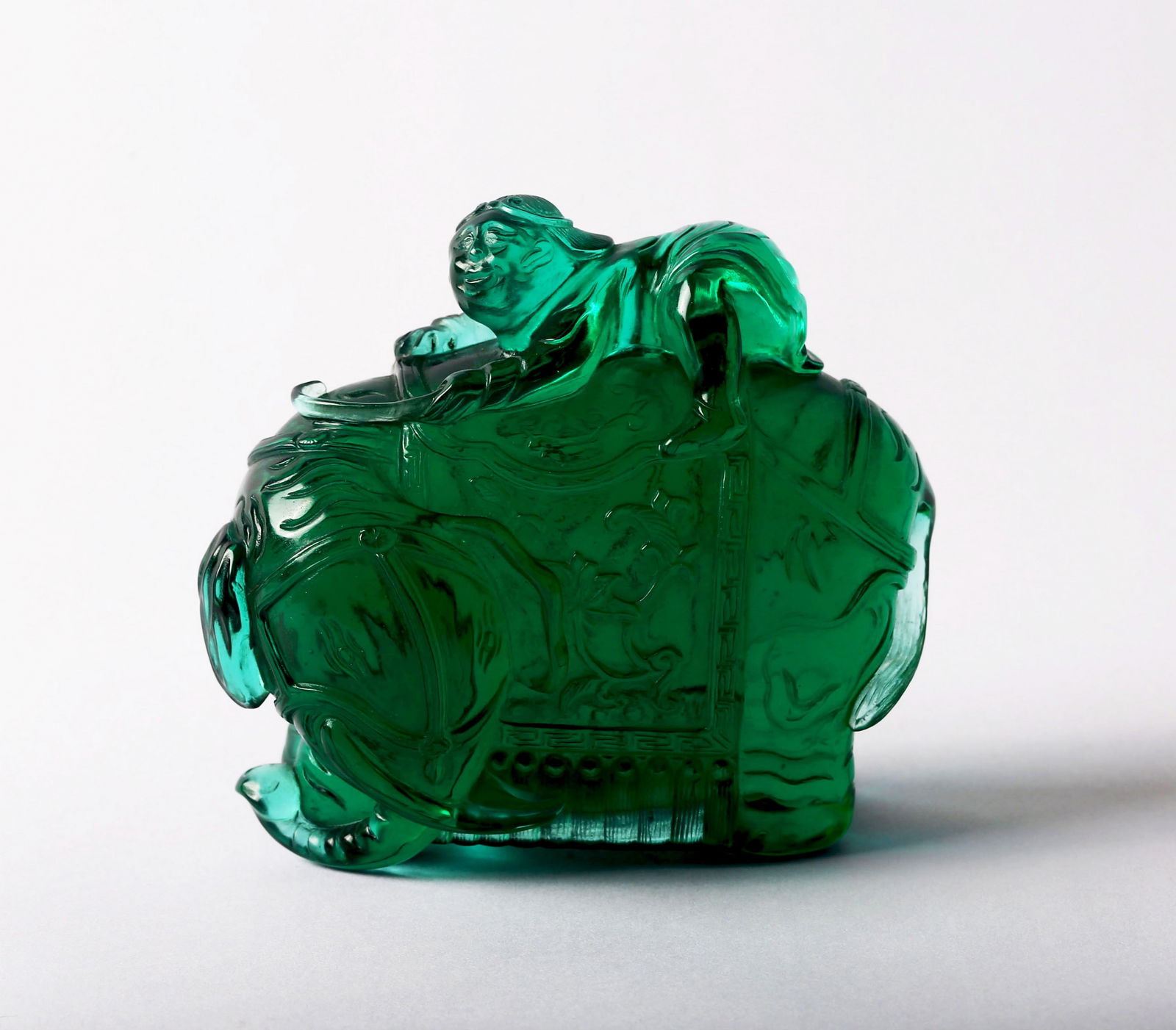 A Transparent Peking Green Glass 'Elephant and Boy' (1 of 10)