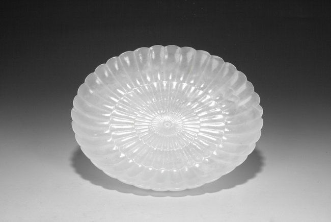 A JADE MUGHAL STYLE "CHRYSANTHEMUM" PLATE: This Mughal style chrysanthemum plate was expertly executed to achieve an extremely thin wall. The plate rests on small foot ring, with bottom bears a four character "QIANLONG" mark. D: 7 7/8 in (20 c