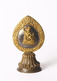 A Tibetan Gilt Bronze Avalokiteshvara Ritual Emblem