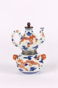 An Iron Red Blue and White 'Dragons' Warming Ewer