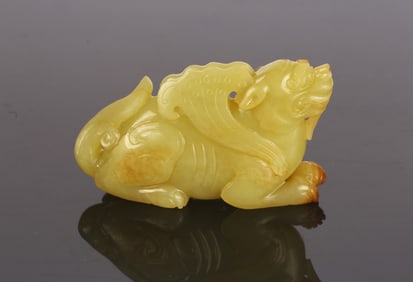 A Chinese Yellow Jade Carved Mythical Beast
