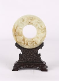A Chinese White Jade 'Chilong' Disc Table Screen