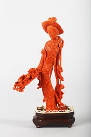 A Chinese Coral 'Consort Rong' Carving