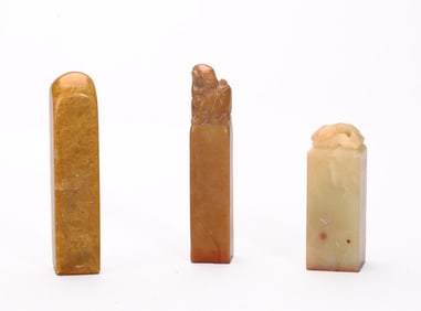 A Group of Three Soapstone Seals