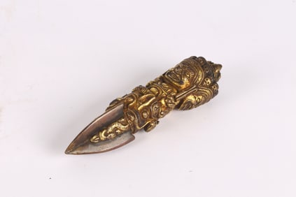 A Gilt Bronze Three Faced Phurba