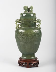 A Chinese Green Jade' Taotie' Vase and Cover