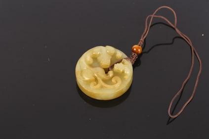 A Chinese Jade Chilong Disc Bi Pendant