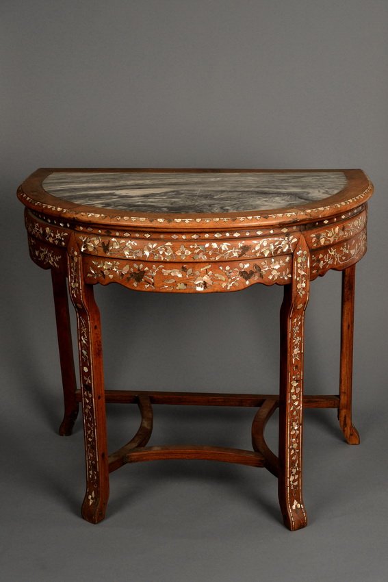 A HARDWOOD SEMI-CIRCULAR TABLE: A hardwood semi-circular table inset with limestone panels and mother of pearls, depicting a scene of blooming flowers. Qing Dynasty period. Dimensions: H: 31 1/2 in (80 cm), D: 32 1/2 in (83 cm)