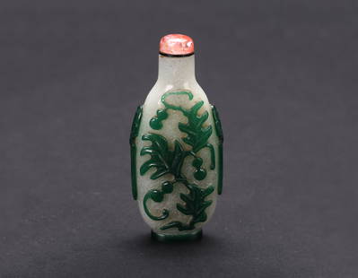 A Green Overlay 'Gourds' Glass Snuff Bottle: 清 套綠料瓜瓞圖鼻煙壺 Carved to each side through the green overlay with gourds and leafy branch. Tourmaline stopper. Qing Dynasty period.