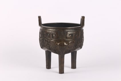 A Chinese Bronze 'Elephant' Tripod Ding Vessel