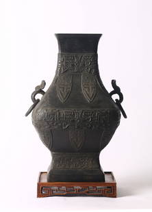 A Chinese Archaistic Bronze Hu Vase: 元/明 銅饕餮紋活環耳壺 Of similar pear shape with a wide rectangular mouth, supported on a square splayed foot, cast with bands of