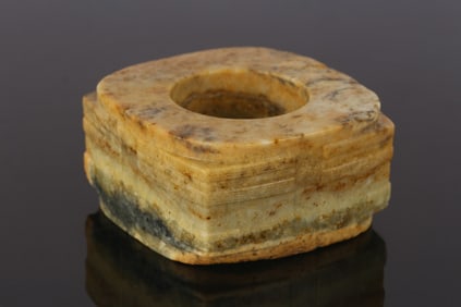 A Chinese Mottled Russet Jade Cong