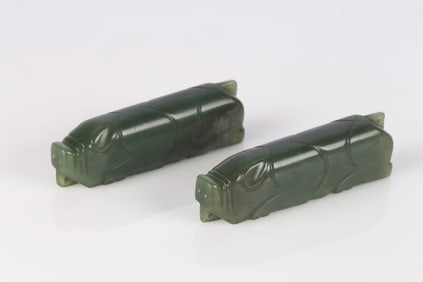 A Pair of Chinese Green Jade Recumbent Pigs
