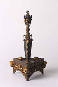 A Tibetan Gold Decorated Iron Phurba and Stand