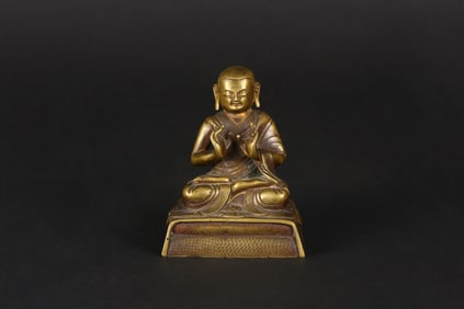 A Gilt Copper Alloy Figure of Lama