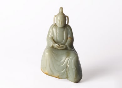A Chinese Celadon Jade Carving of Seated Bodhisattva