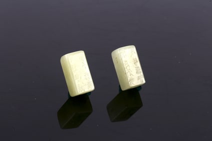 A Pair of White Jade Inscribed Pendants