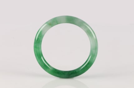 A Mottled Green Jadeite Bangle