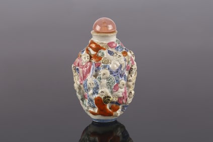 A Famille Rose Moulded Porcelain Snuff Bottle