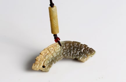 A Jade 'Dragon' Huang and Cylinder Pendant