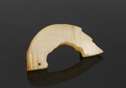 An Unfinished White Jade 'Dragon' Pendant