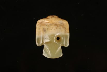 A Celadon and Beige Jade 'Bird' Pendant