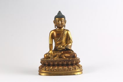 A Cold-Gilt Bronze Figure of Seated Shakyamuni