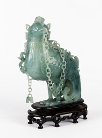 An Elaborate Jadeite 'Phoenix' Vase and Cover