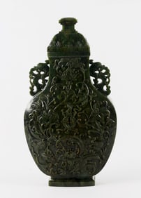 A Green Jade 'Eight Emblems' Vase and Cover