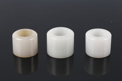 A Group of Three White Jade Archer's Rings