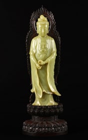 A Very Large Chinese Yellow Jade Figure of Guanyin