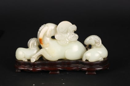A Chinese White Jade 'Three Ram' Carving