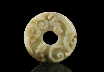 A Celadon Jade 'Chilong' Bi Disc