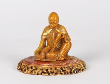 A Chinese Inscribed Soapstone Seated Arhat with Stand
