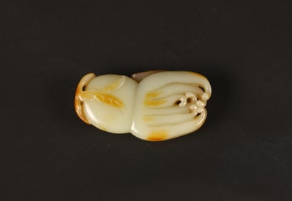 A Chinese White and Russet Jade Finger Citron