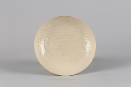 A Ding-Type White Glazed Moulded 'Dragon' Dish