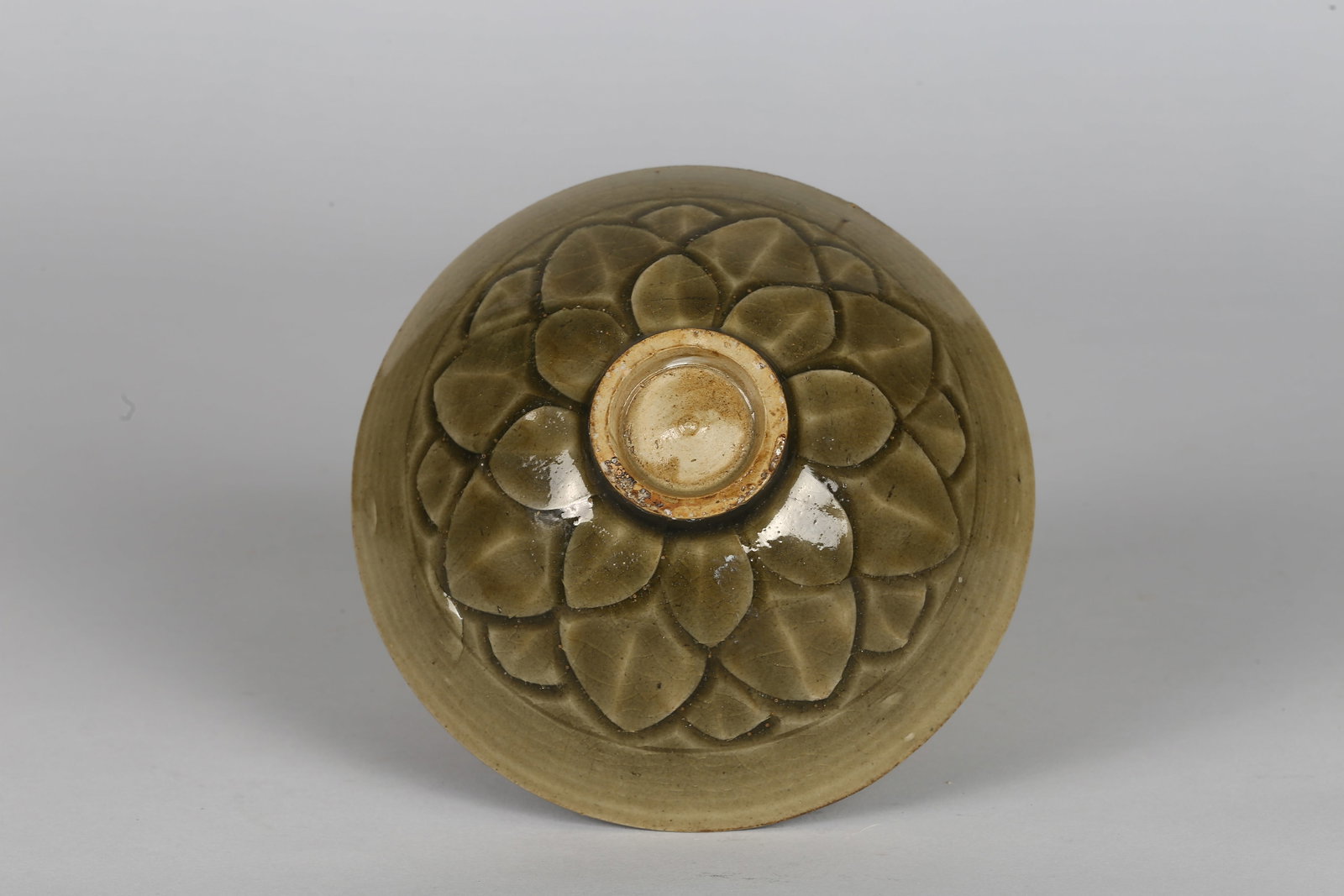 A Chinese Yaozhou Celadon 'Lotus' Bowl (1 of 5)